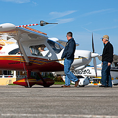 Men looking at Light Sport Aircraft
