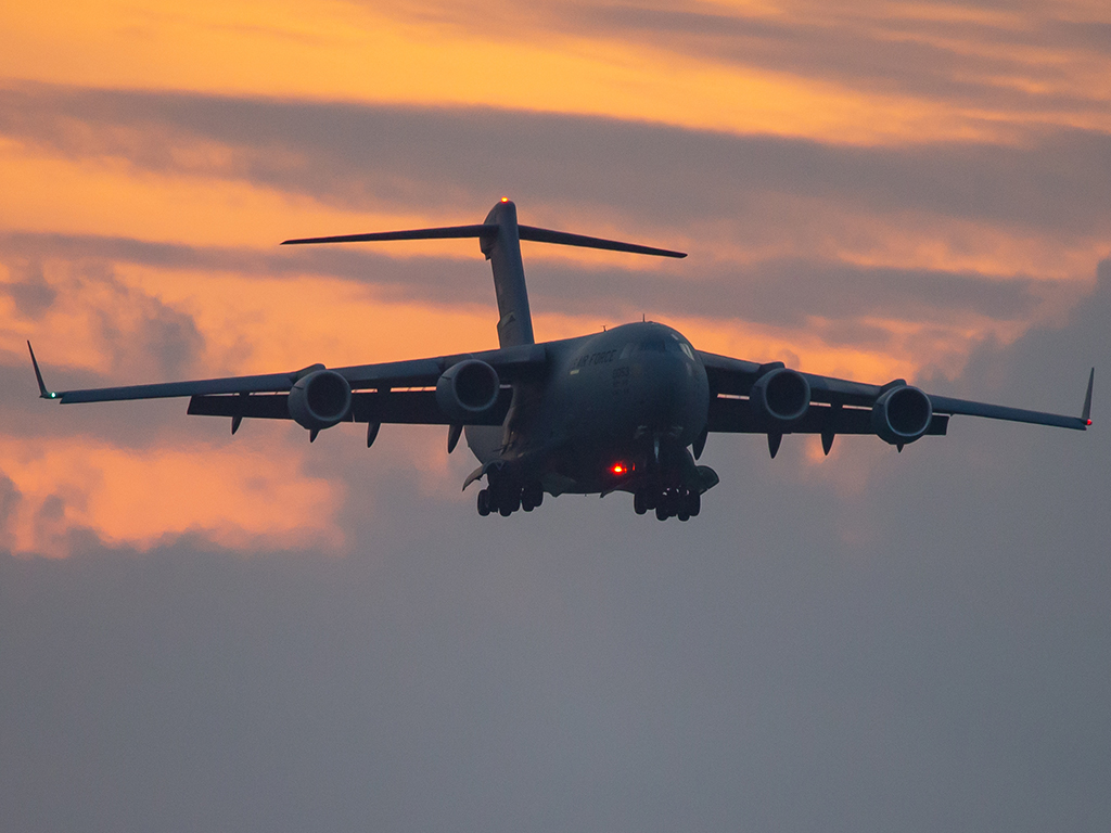 C-17 flying at dusk