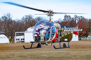 Santa arrives at EAA's annual Christmas in the Air Open House by helicopter