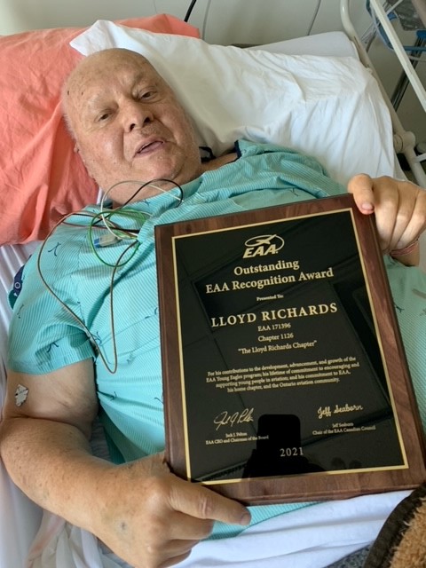 Lloyd Richards receives his plaque in a hospital bed